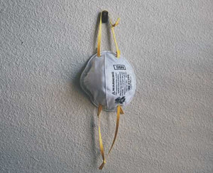 kn95 mask shown hanging from a surface