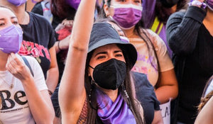 shop masks for large faces, woman wearing kn95 mask at a sports event