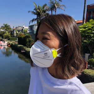 3pe n95 mask worn by young woman outside