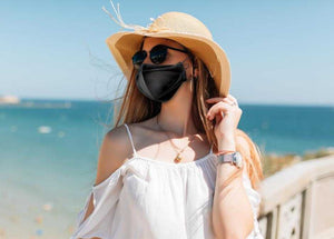 woman wearing kf94 mask near a beach