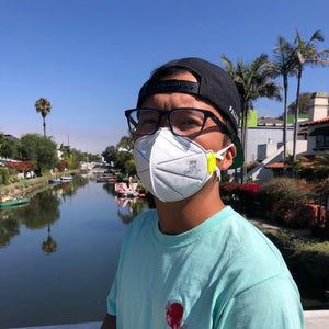 3pe n95 mask worn by young man outside